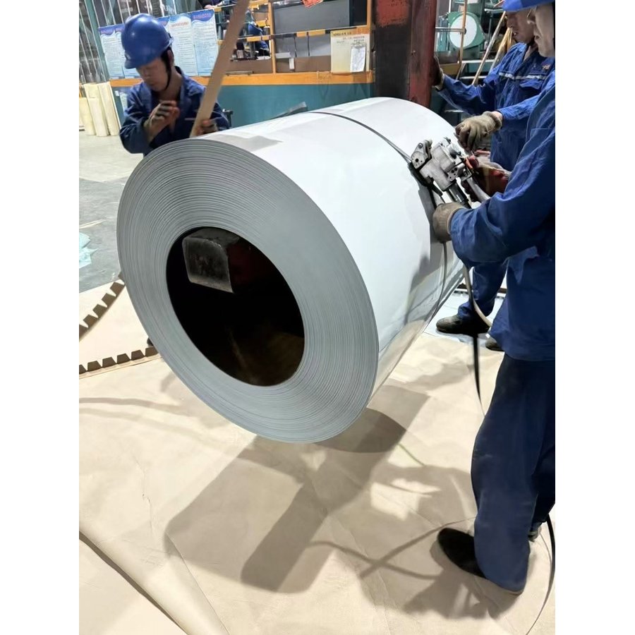 Workers packing white galvanized color coated steel coil